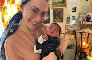 Malki holding a baby